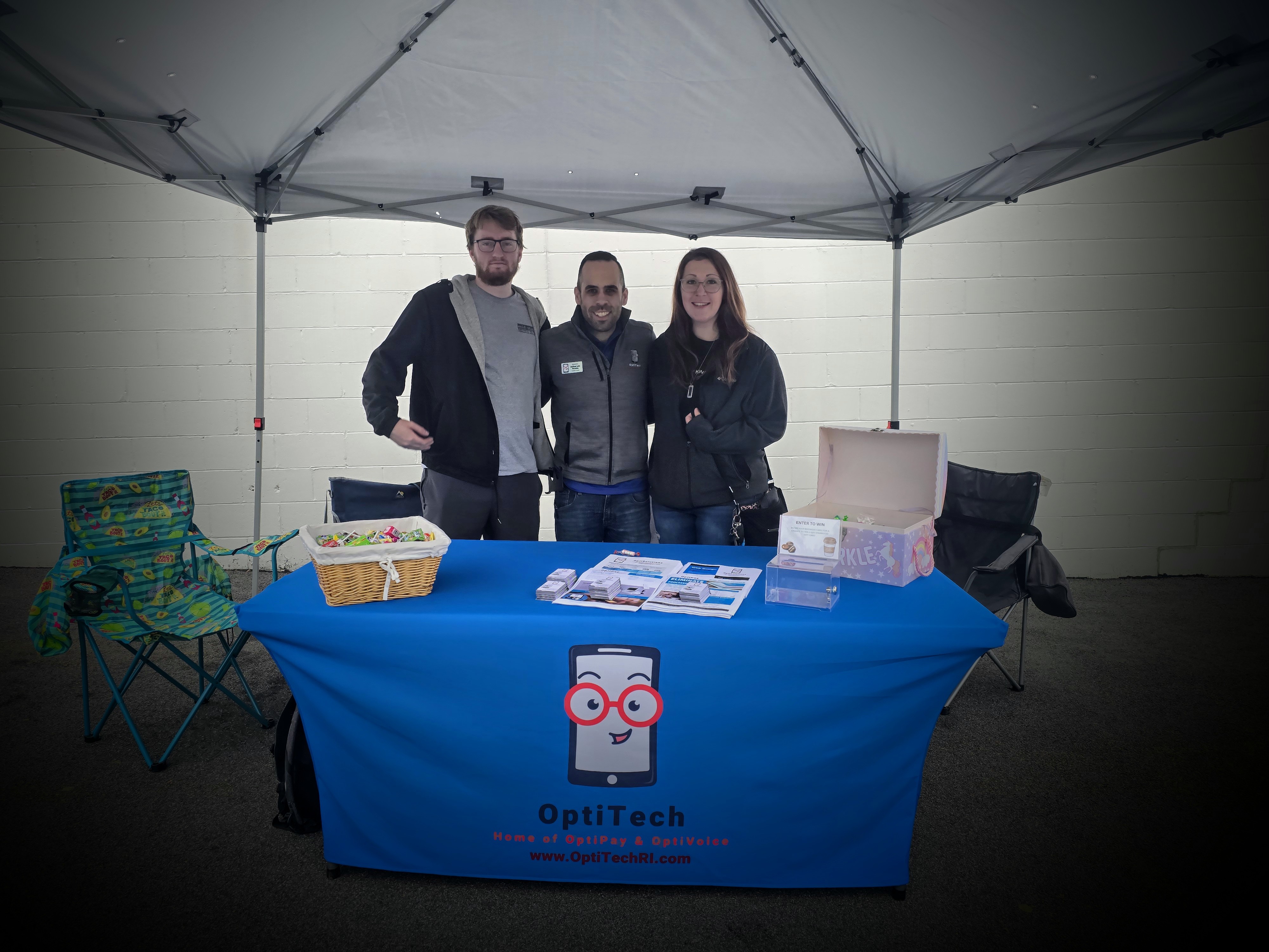 The OptiSolutions team at a community outreach event in Rhode Island